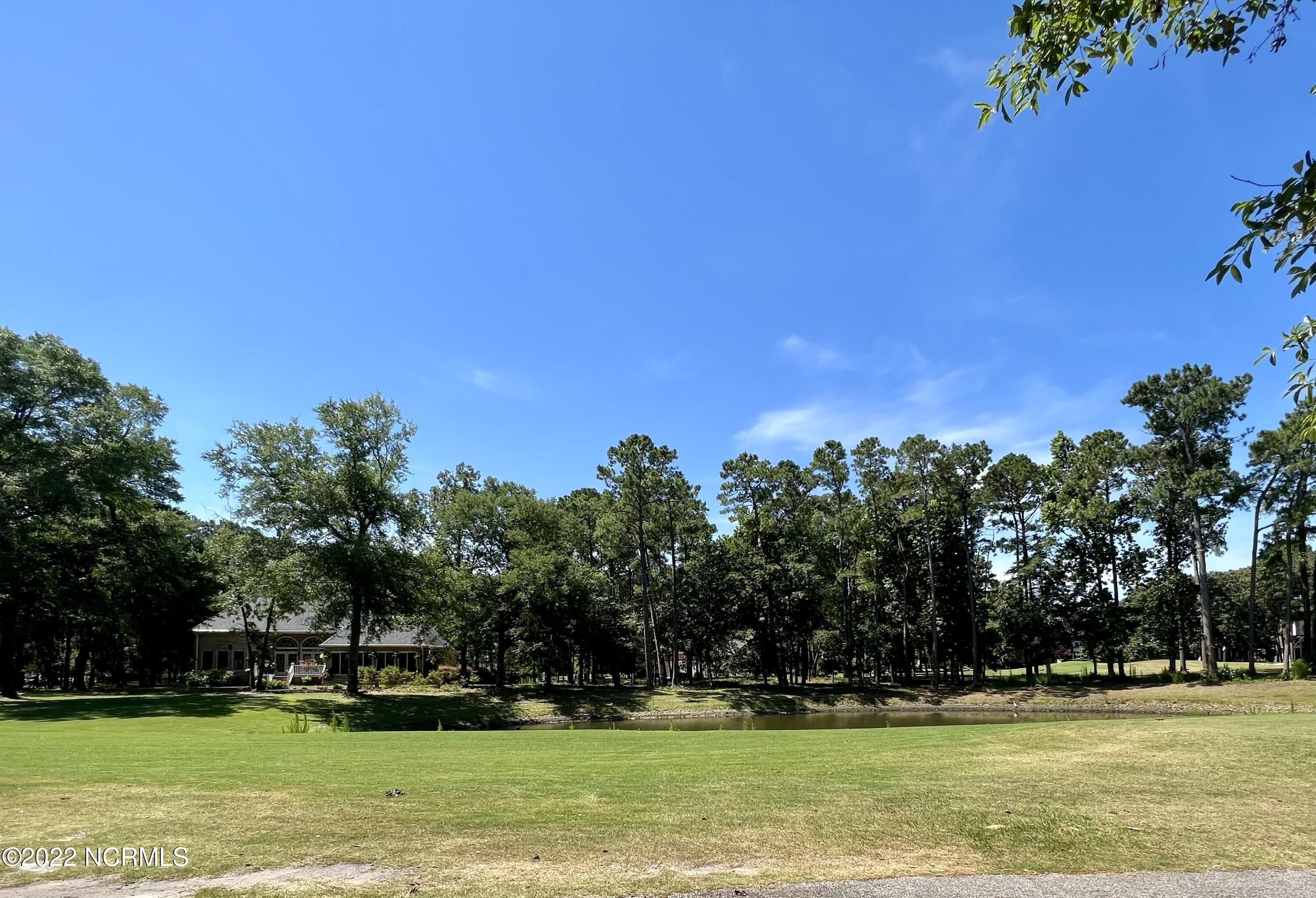 401 Genoe's Point Road Southwest Supply, NC 28462 - Photo 14 of 33 Golf course view from back of lot