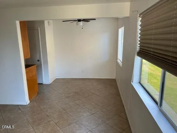 a view of hallway with stairs and wooden floor