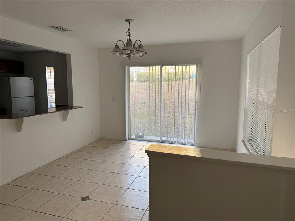 201 Drawbridge Lane Valrico, FL 33594 - Photo 3 of 11 a view of an empty room with a window