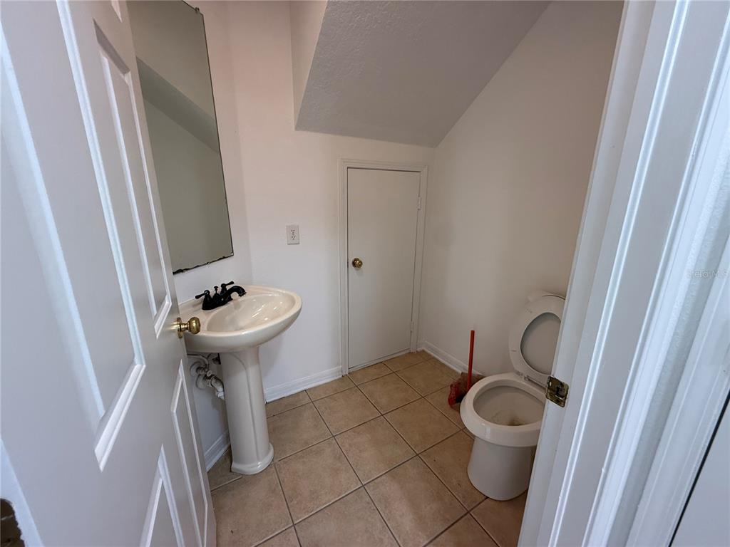 201 Drawbridge Lane Valrico, FL 33594 - Photo 6 of 11 a bathroom with a sink and mirror