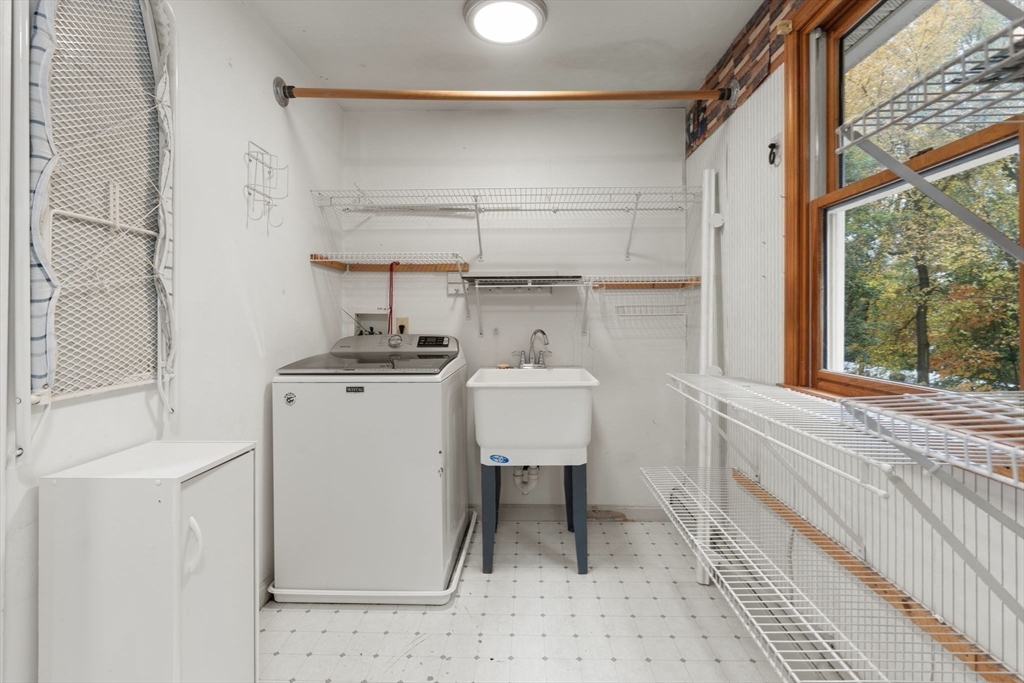 8 McDonald Road Wilmington, MA 01887 - Photo 21 of 40 a bathroom with a sink a toilet and a mirror