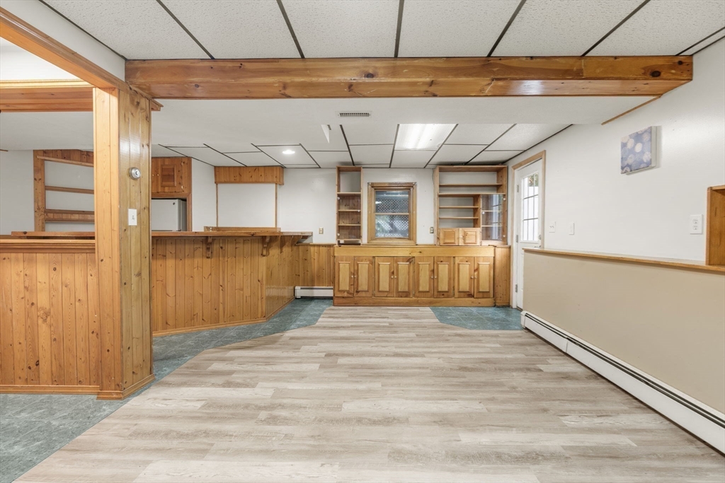 8 McDonald Road Wilmington, MA 01887 - Photo 29 of 40 a view of a room with wooden floor and a window