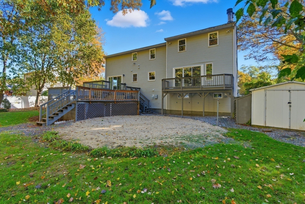 8 McDonald Road Wilmington, MA 01887 - Photo 35 of 40 a view of a backyard with plants and a patio