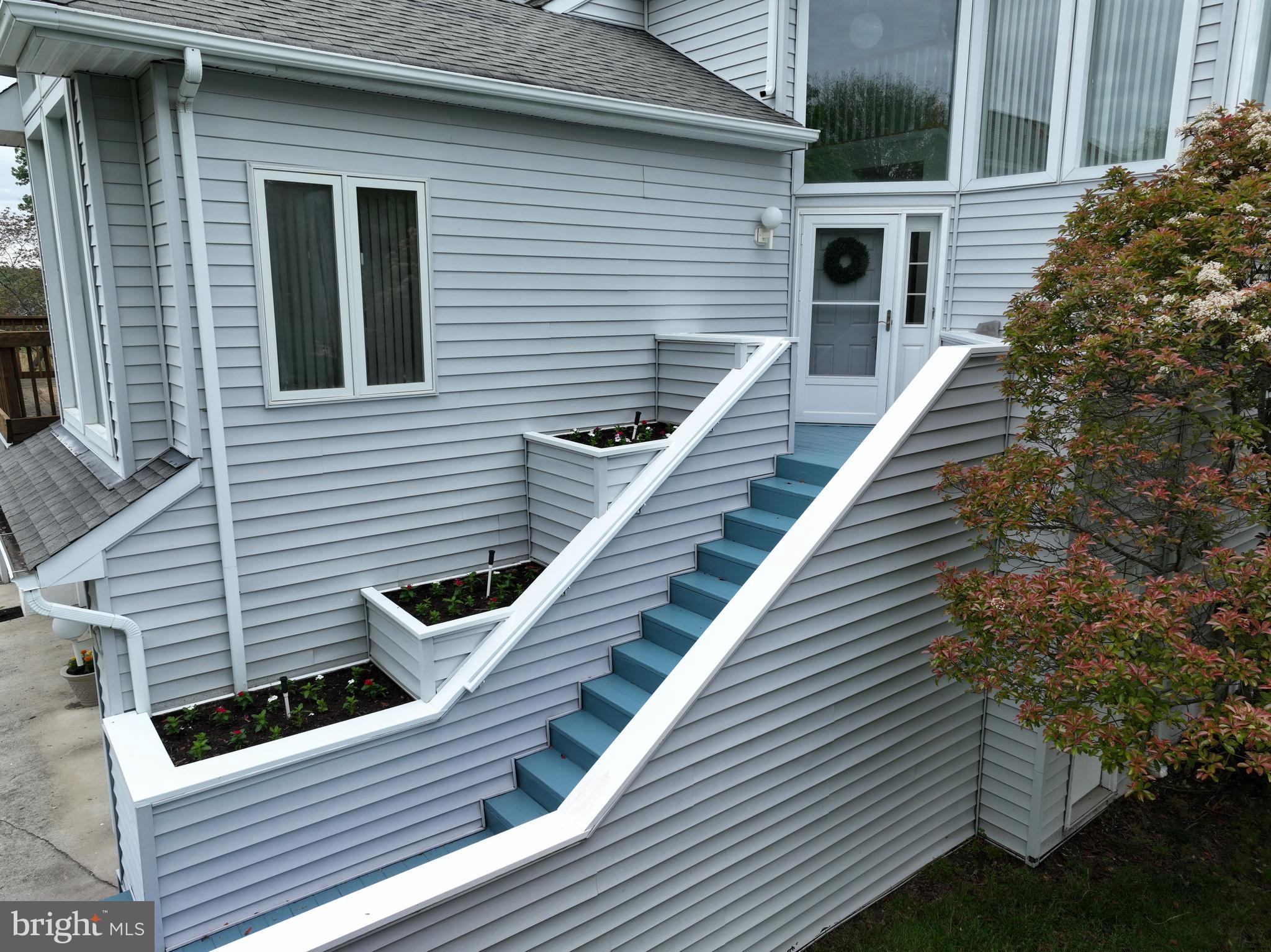 1100 Paca Drive Edgewater, MD 21037 - Photo 57 of 60 Front stairs with flower beds with irrigation