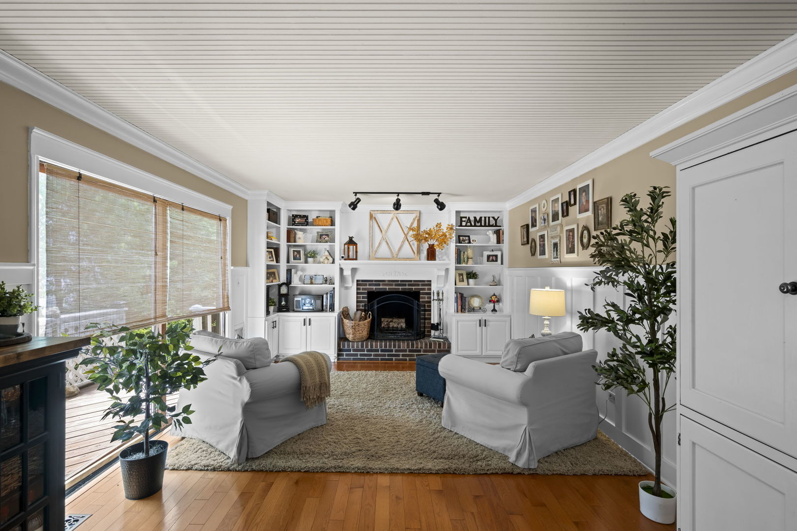 1565 Freeman Road Hoffman Estates, IL 60192 - Photo 22 of 46 a living room with furniture and a fireplace