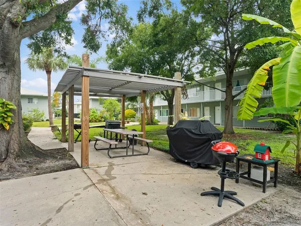a kitchen with granite countertop a sink and a stove