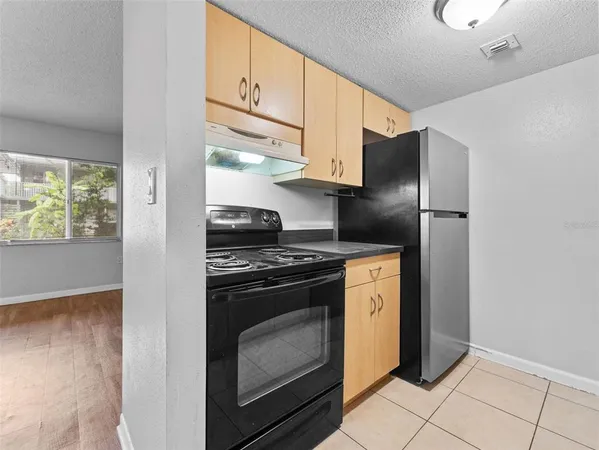 a view of an empty room and closet area