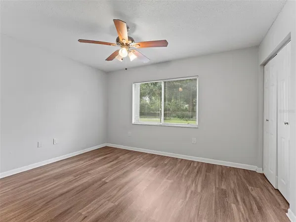a kitchen with granite countertop a sink and cabinets