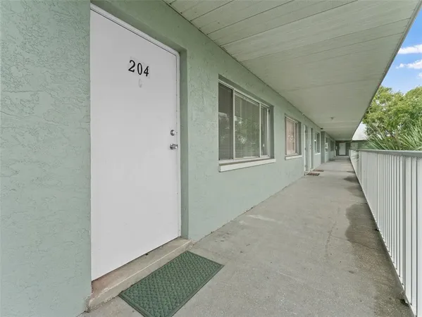 an aerial view of houses with yard