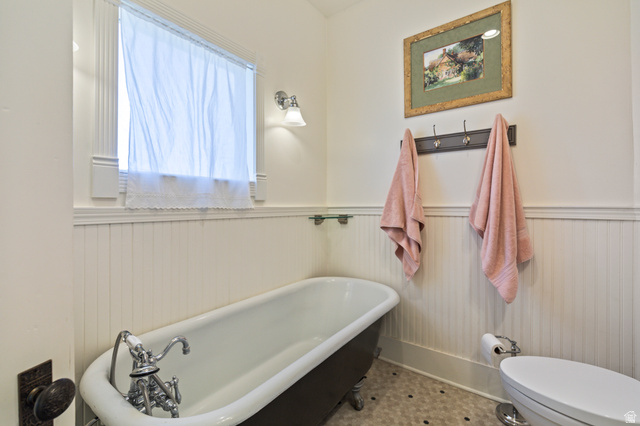 390 North 100 West Monroe, UT 84754 - Photo 102 of 167 Bathroom with a soaking tub and a wainscoted wall