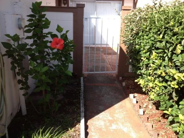 a kitchen with a refrigerator sink and cabinets