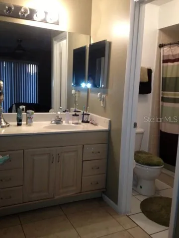 a bathroom with a toilet and a sink
