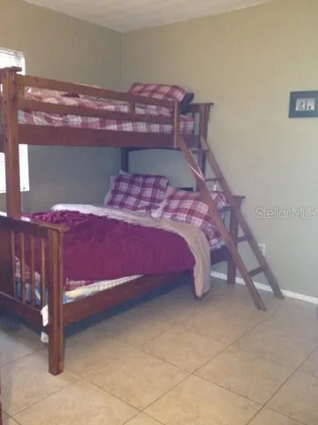 a kitchen with granite countertop white cabinets sink and stainless steel appliances