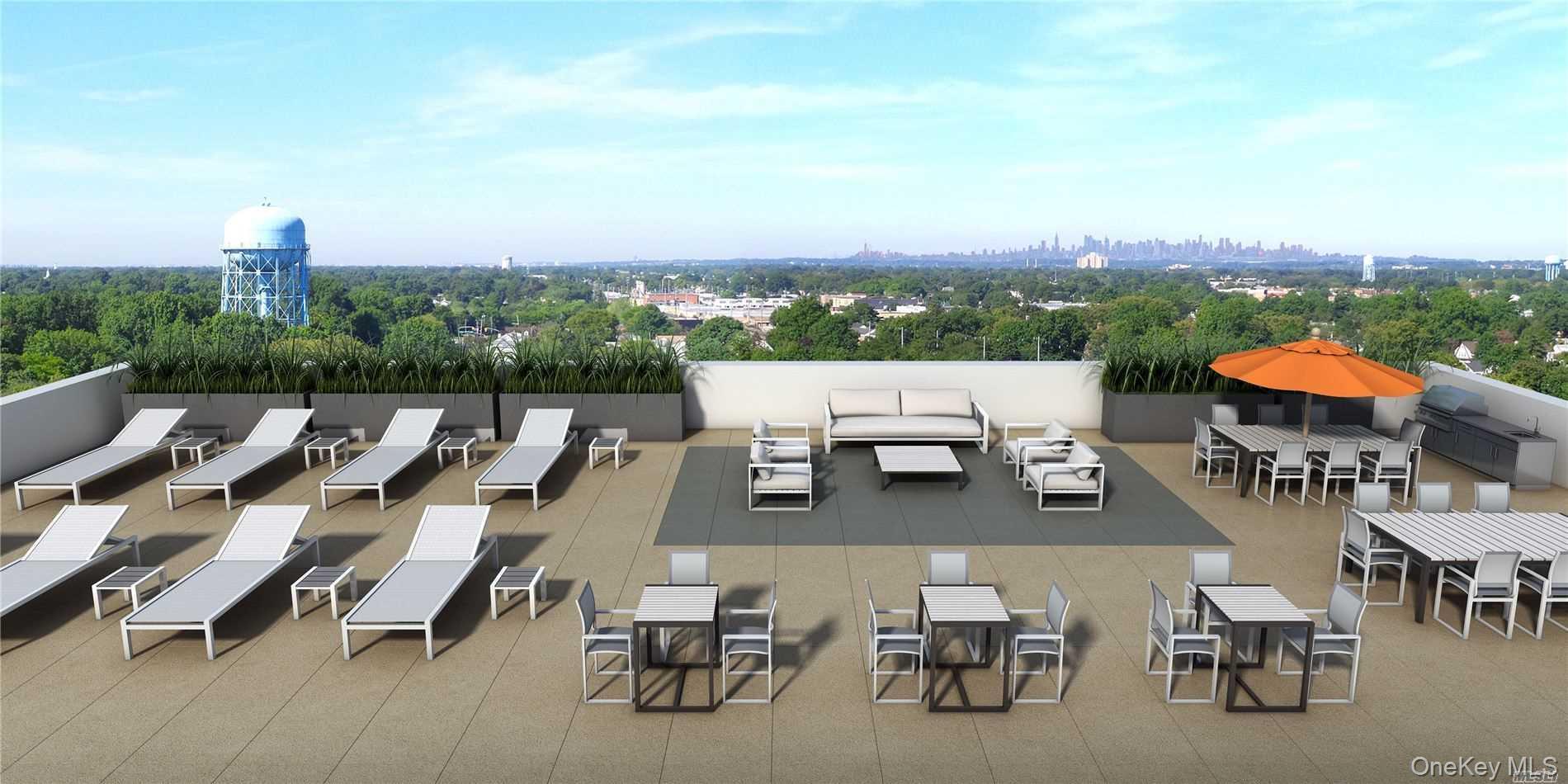 1 3rd, Unit 825 Mineola, NY 11501 - Photo 4 of 25 an aerial view of a terrace with outdoor seating and city view