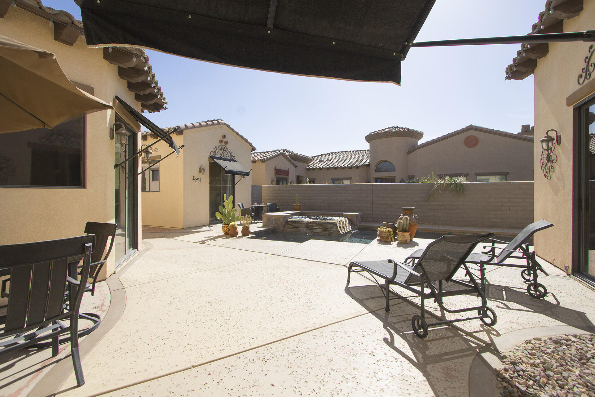 57669 Santa Rosa Trail La Quinta, CA 92253 - Photo 22 of 59 a view of a terrace with furniture and a flat screen tv