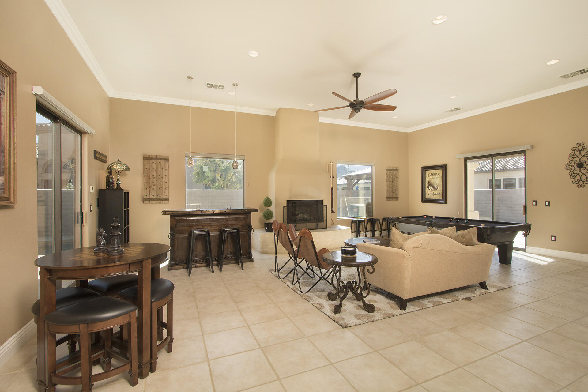 57669 Santa Rosa Trail La Quinta, CA 92253 - Photo 24 of 59 a living room with furniture a fireplace and a flat screen tv