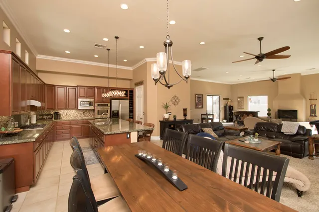 a bedroom with a large bed and a television