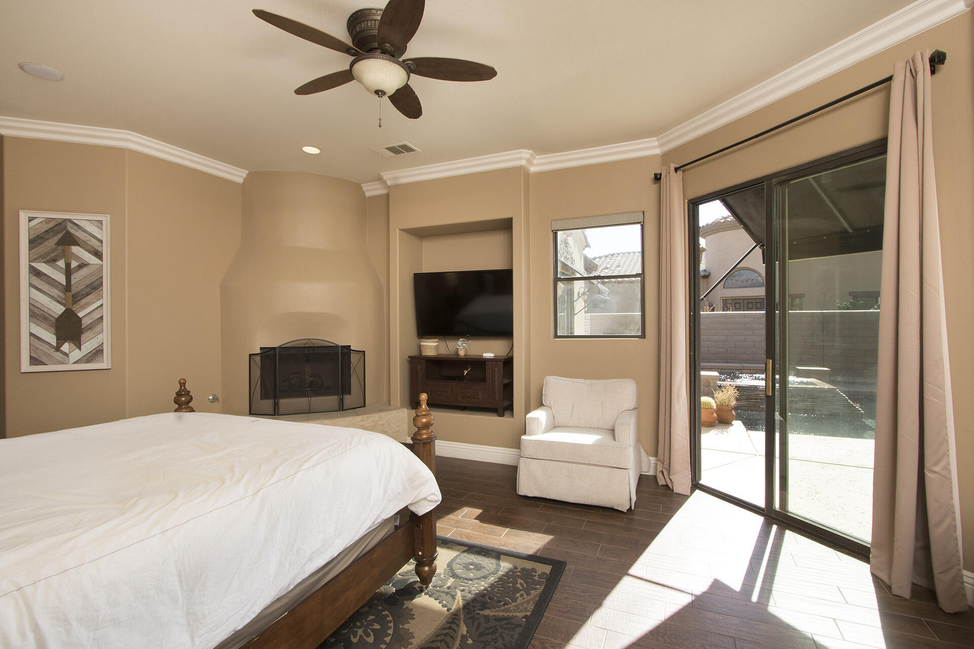 57669 Santa Rosa Trail La Quinta, CA 92253 - Photo 34 of 59 a bedroom with a large bed and a chandelier