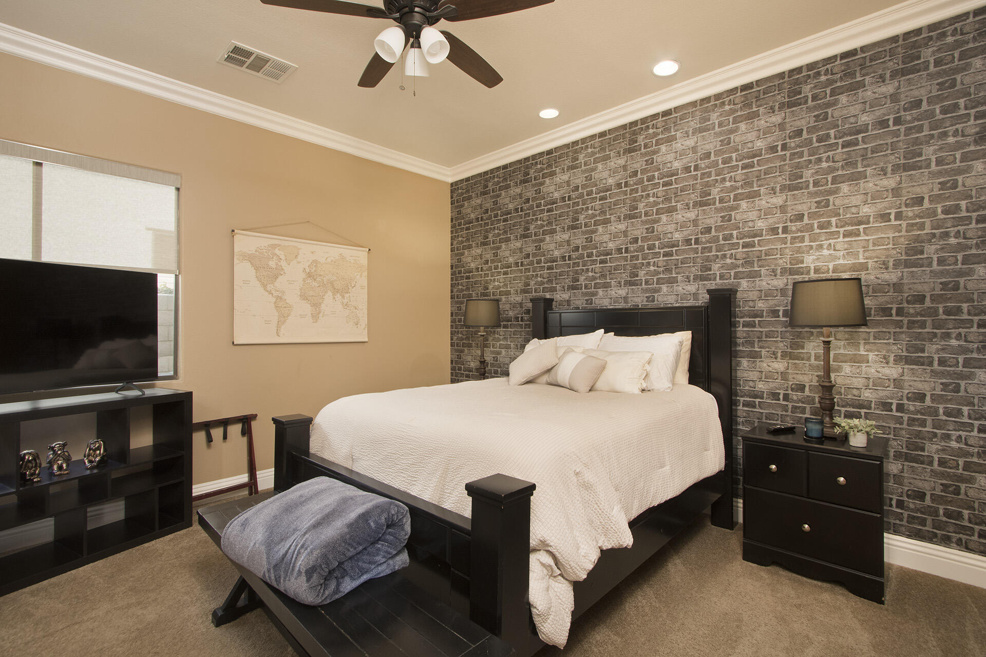 57669 Santa Rosa Trail La Quinta, CA 92253 - Photo 41 of 59 a spacious bedroom with a bed and a flat screen tv