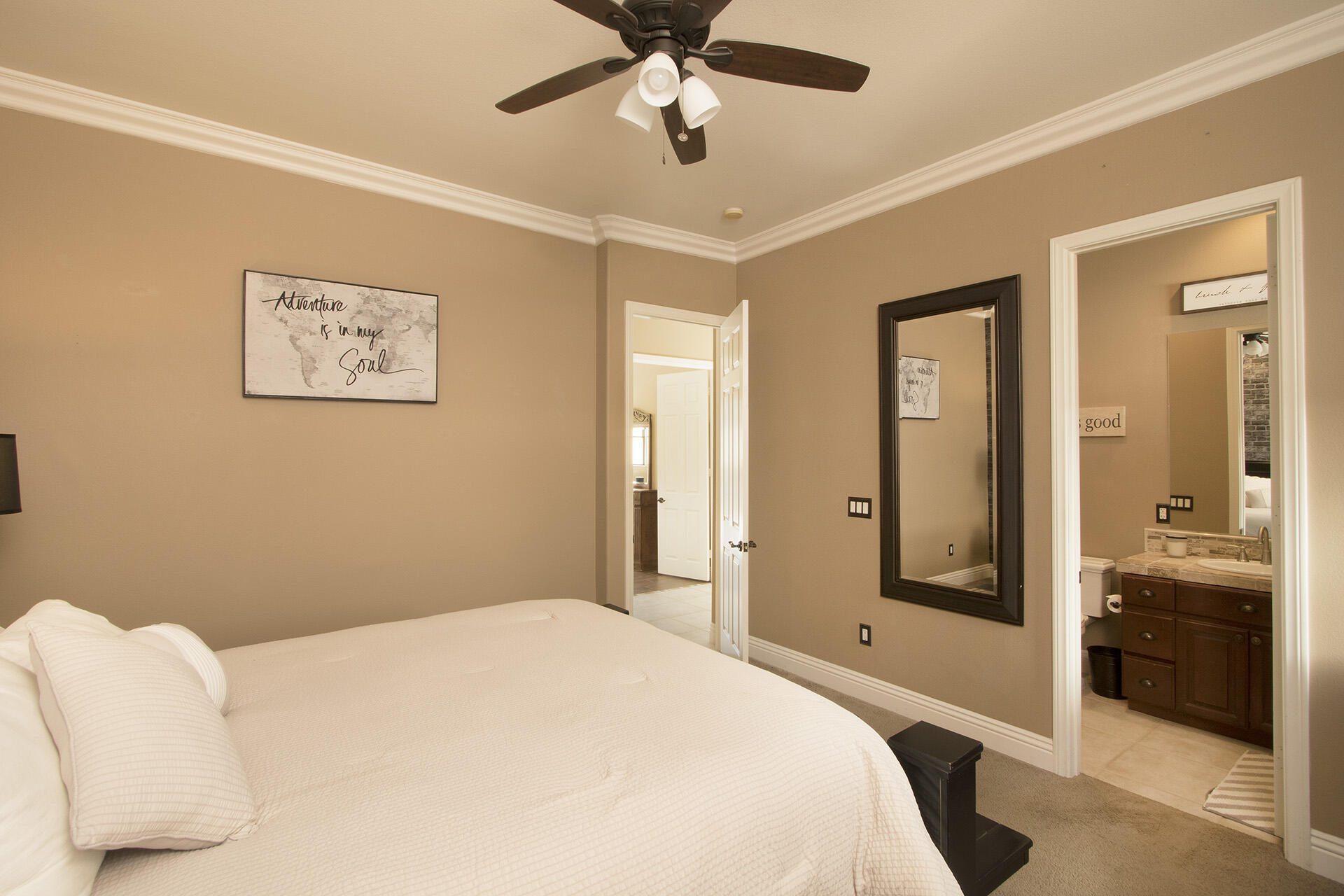 57669 Santa Rosa Trail La Quinta, CA 92253 - Photo 43 of 59 a bedroom with a large bed and a chandelier