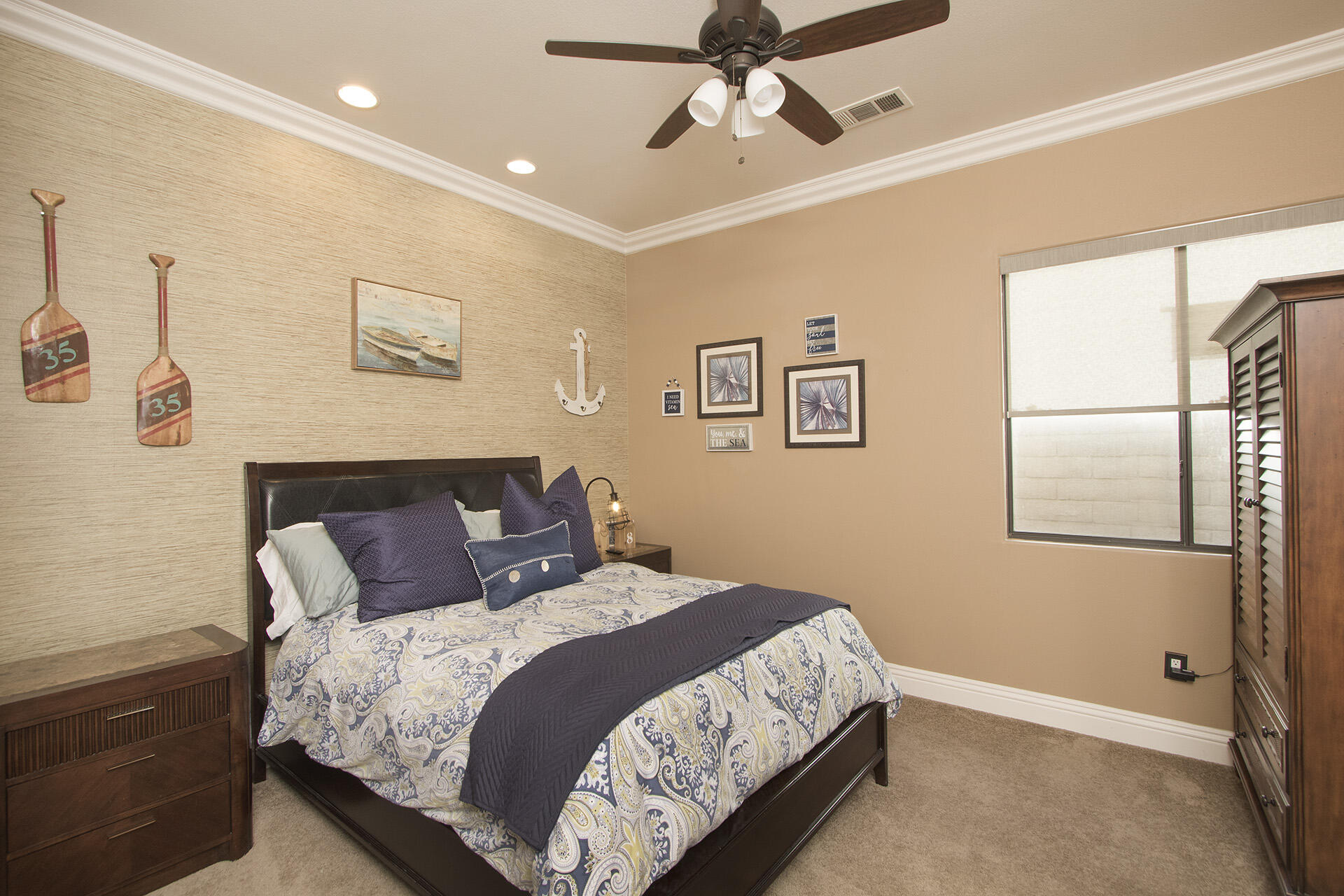 57669 Santa Rosa Trail La Quinta, CA 92253 - Photo 44 of 59 a bedroom with a large bed and a ceiling fan