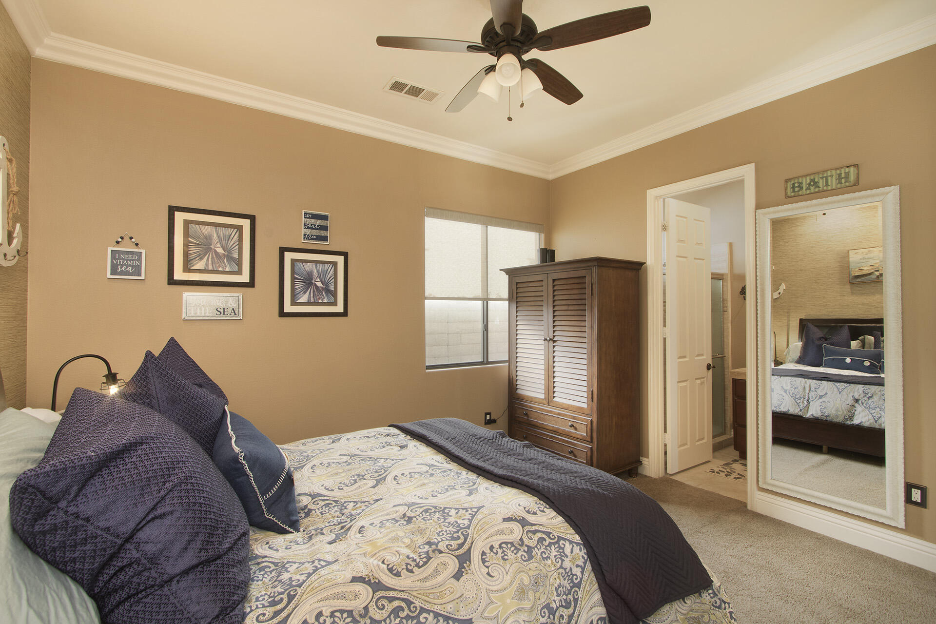 57669 Santa Rosa Trail La Quinta, CA 92253 - Photo 45 of 59 a bedroom with a bed and a mirror