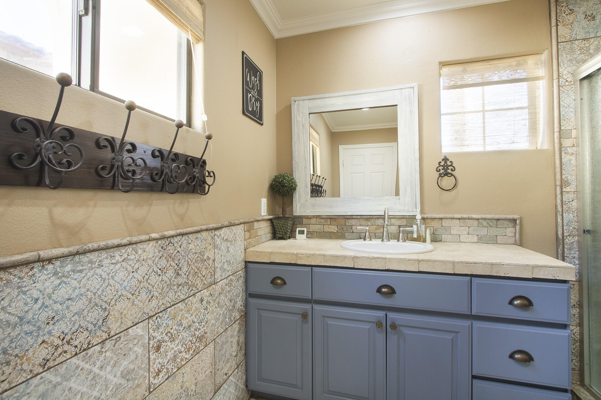 57669 Santa Rosa Trail La Quinta, CA 92253 - Photo 50 of 59 a bathroom with a sink and a mirror