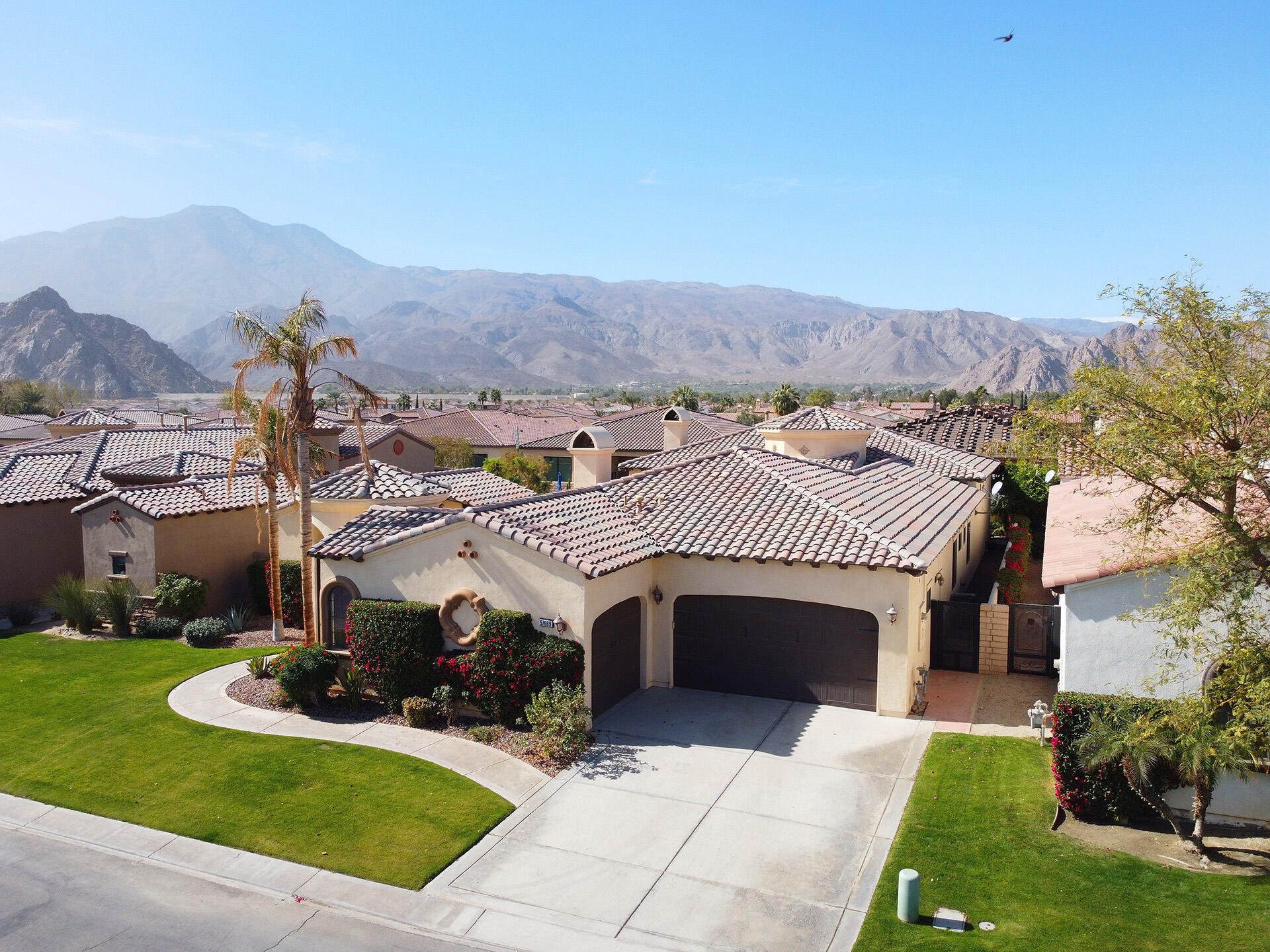 57669 Santa Rosa Trail La Quinta, CA 92253 - Photo 5 of 59 a view of a patio with a yard of the house and front view of a house