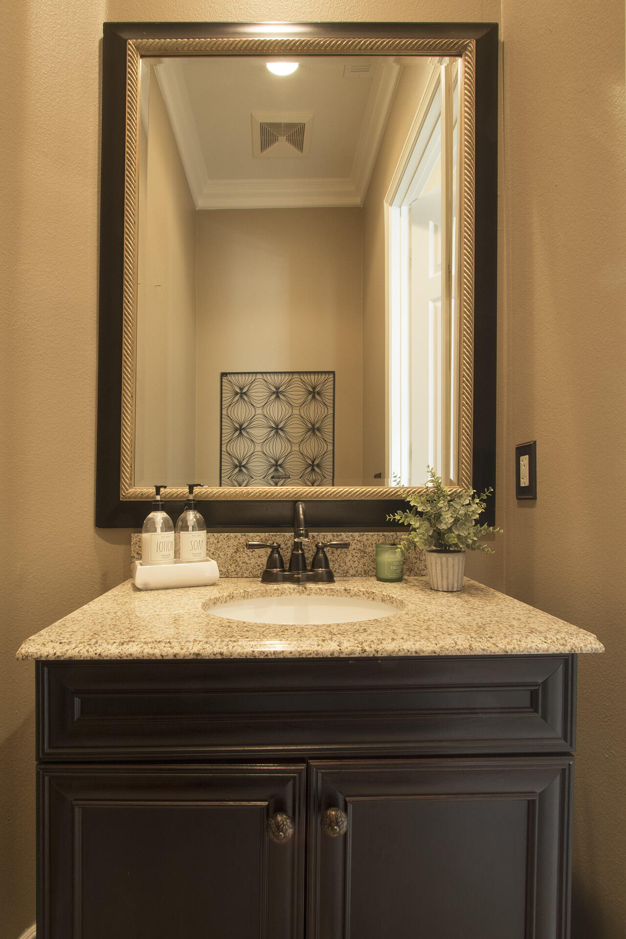 57669 Santa Rosa Trail La Quinta, CA 92253 - Photo 54 of 59 a bathroom with a sink and a mirror