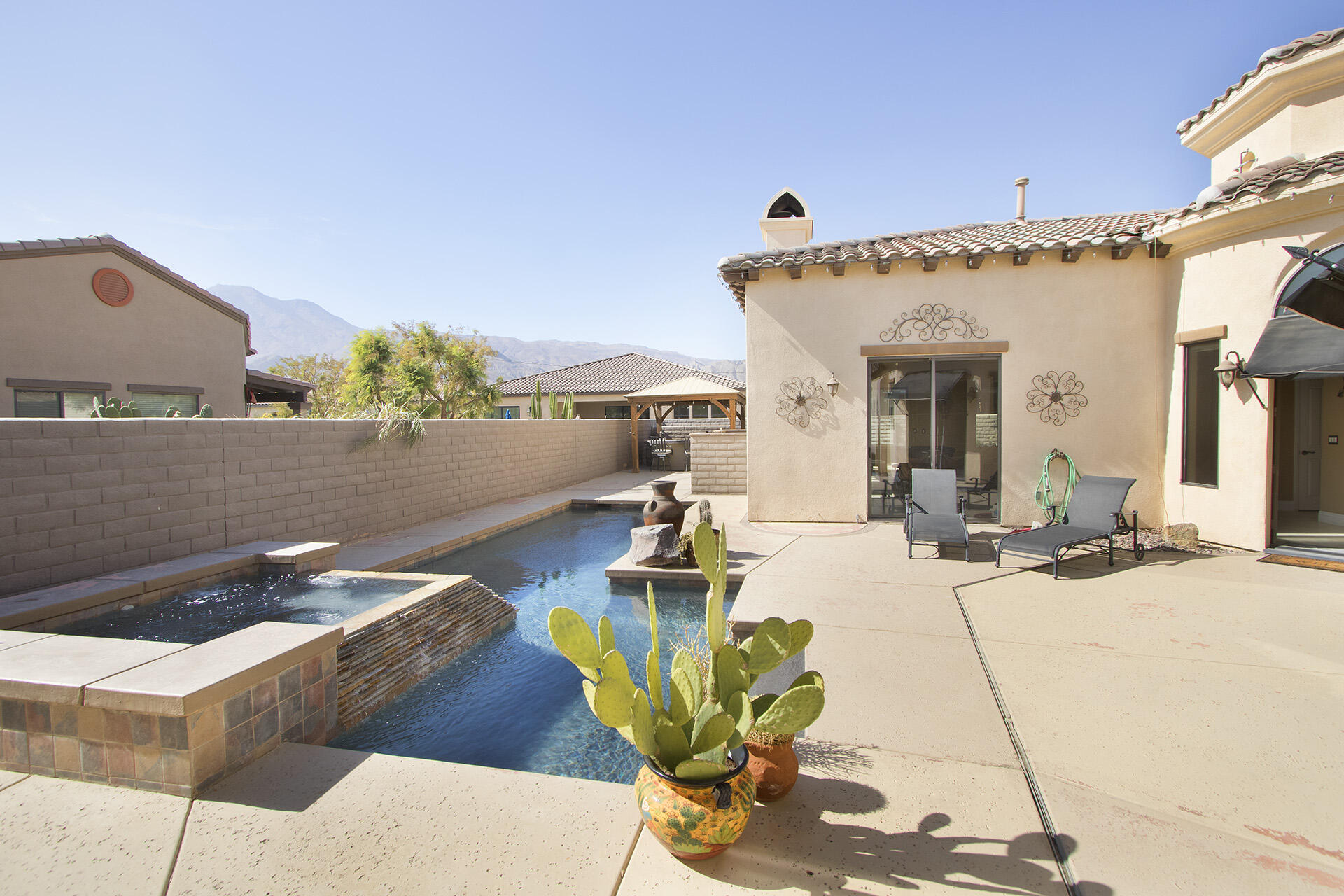 57669 Santa Rosa Trail La Quinta, CA 92253 - Photo 10 of 59 a view of a patio with dining table and chairs