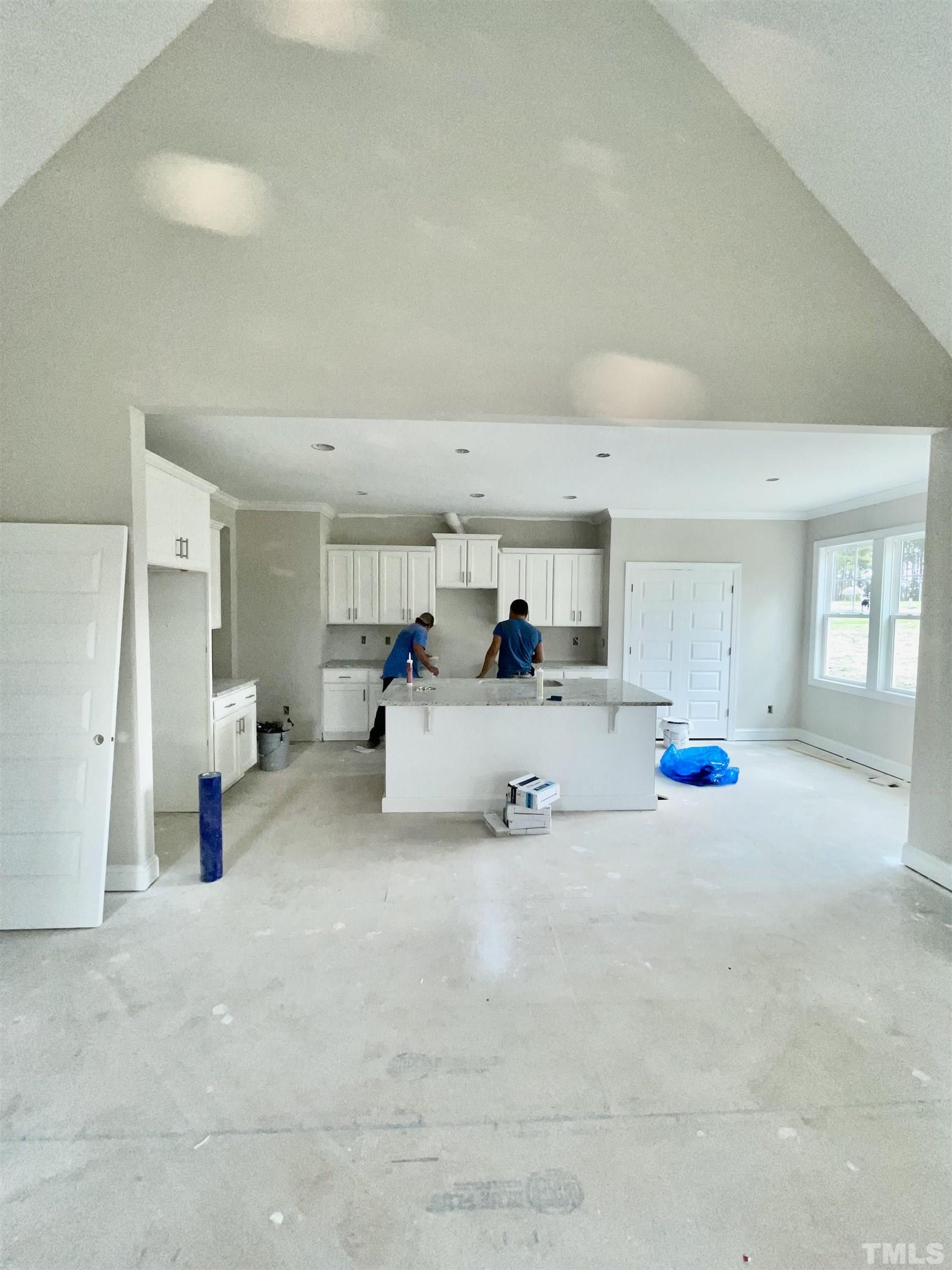 5341 Roseheath Road Bailey, NC 27807 - Photo 12 of 12 a bed room with furniture and a chandelier