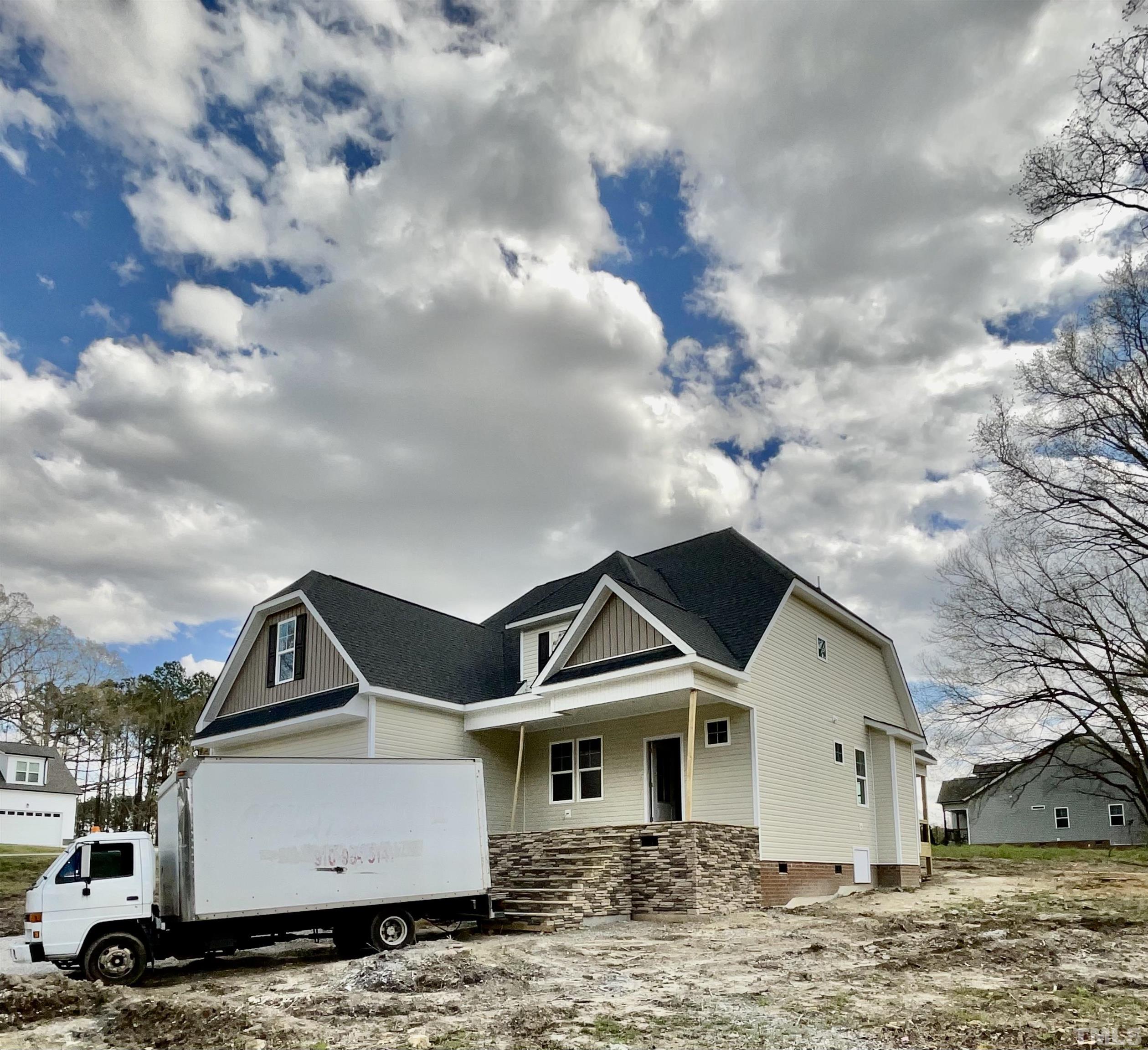 5341 Roseheath Road Bailey, NC 27807 - Photo 3 of 12 a front view of a house with a yard