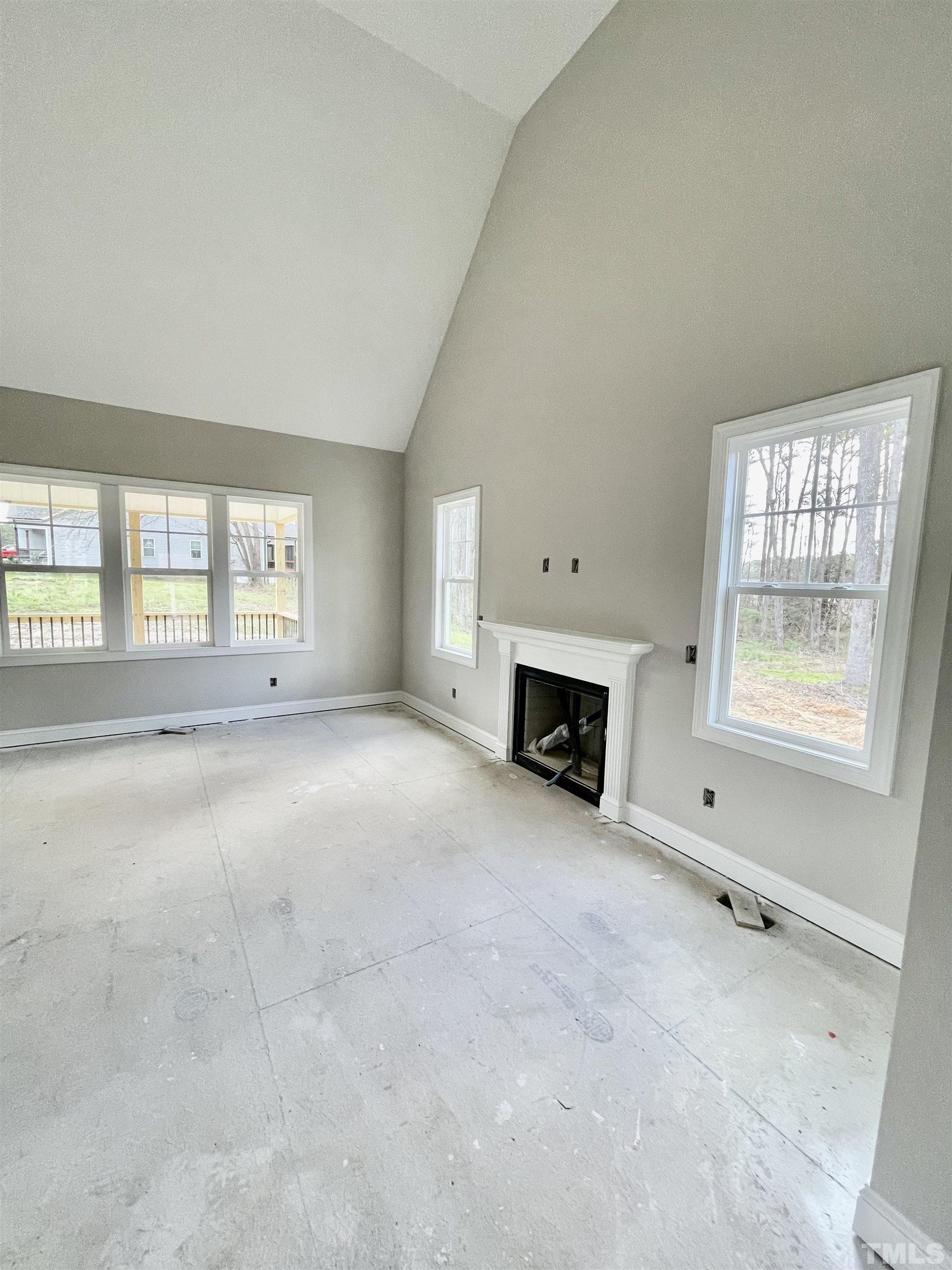 5341 Roseheath Road Bailey, NC 27807 - Photo 7 of 12 an empty room with fireplace