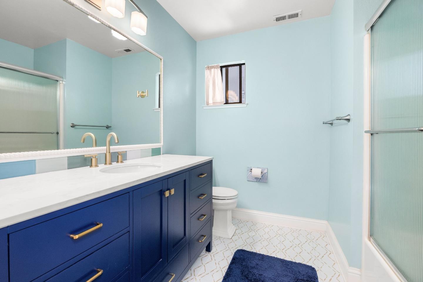 710 Freeman Court Santa Cruz, CA 95062 - Photo 14 of 18 a bathroom with a sink a toilet and a mirror