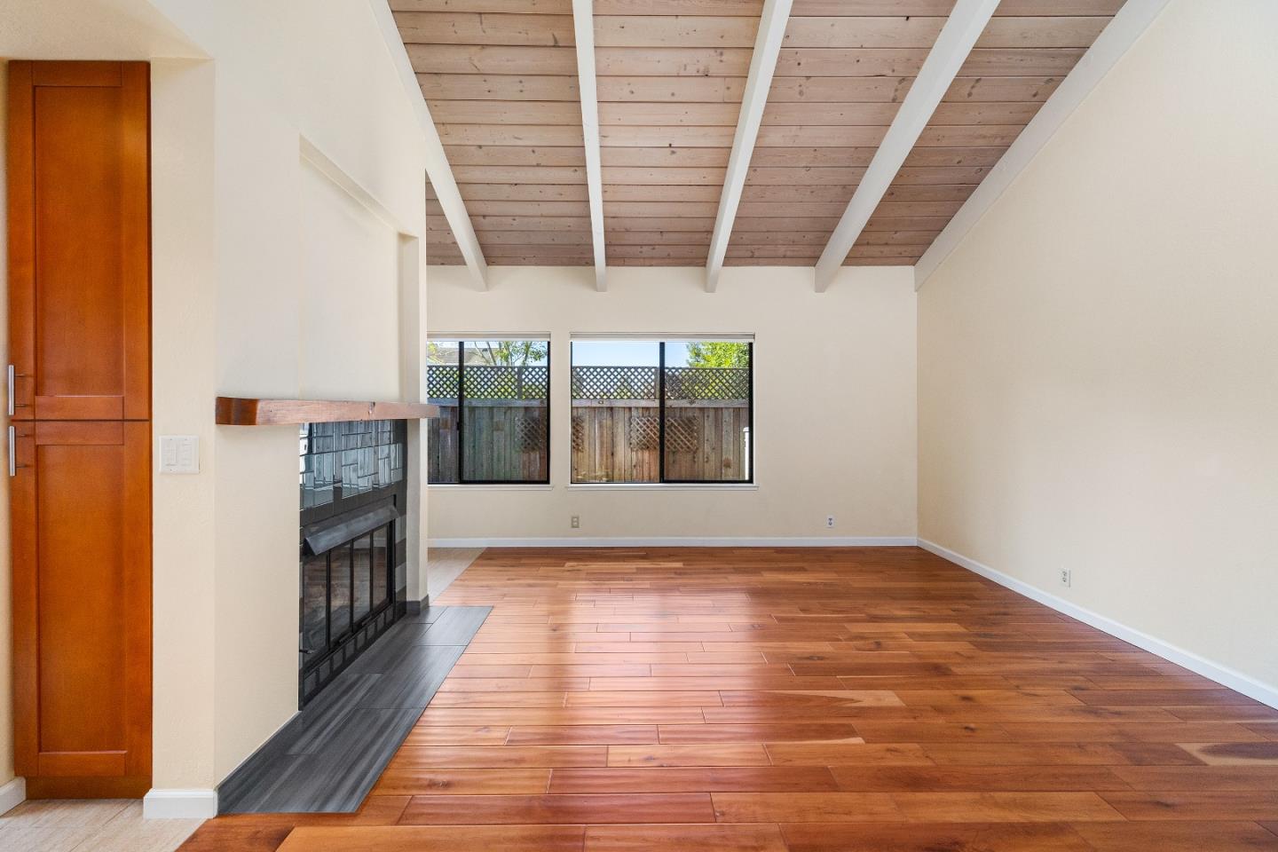 710 Freeman Court Santa Cruz, CA 95062 - Photo 4 of 18 a view of an empty room with a window and wooden floor