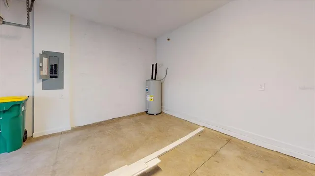 an empty room with wooden floor and window