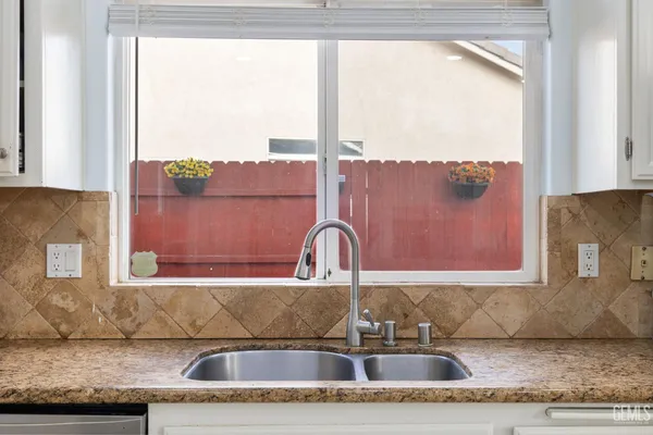 a kitchen with a sink and a window