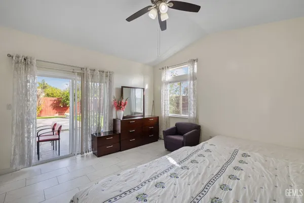 a bed room with a bed and a television