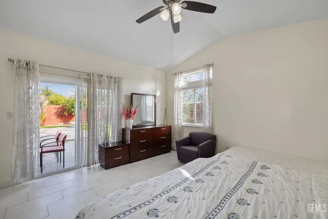 a bed room with a bed and a television