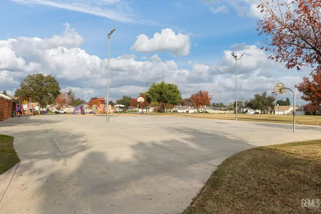 a view of a park with swings and slides