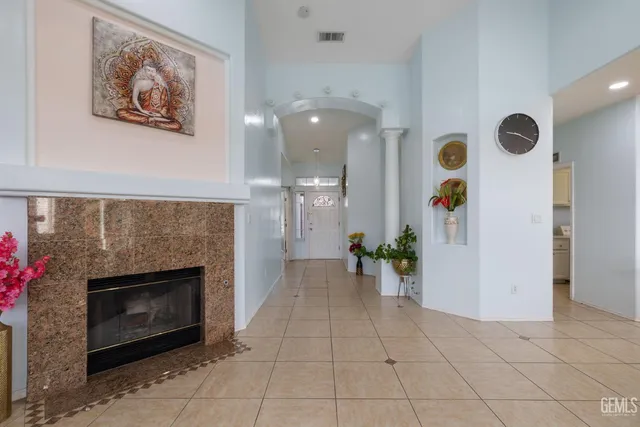 a view of an empty room and fire place