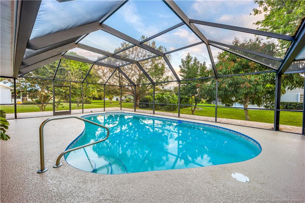 2556 Captiva Cove Stuart, FL 34994 - Photo 21 of 68 a view of a swimming pool with a backyard