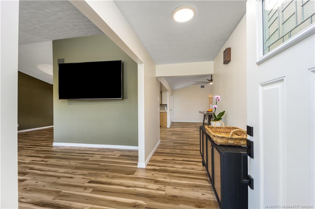 2556 Captiva Cove Stuart, FL 34994 - Photo 23 of 68 a living room with furniture and a flat screen tv