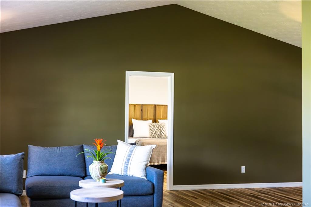 2556 Captiva Cove Stuart, FL 34994 - Photo 27 of 68 a living room with couch and a potted plant
