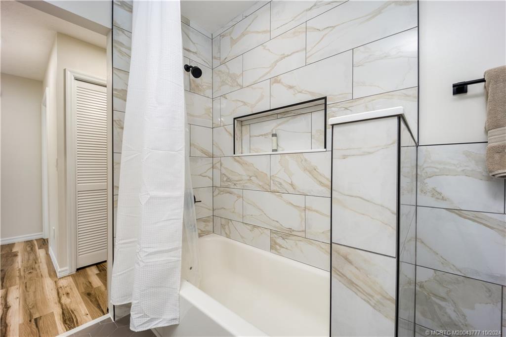 2556 Captiva Cove Stuart, FL 34994 - Photo 52 of 68 a bathroom with a bathtub