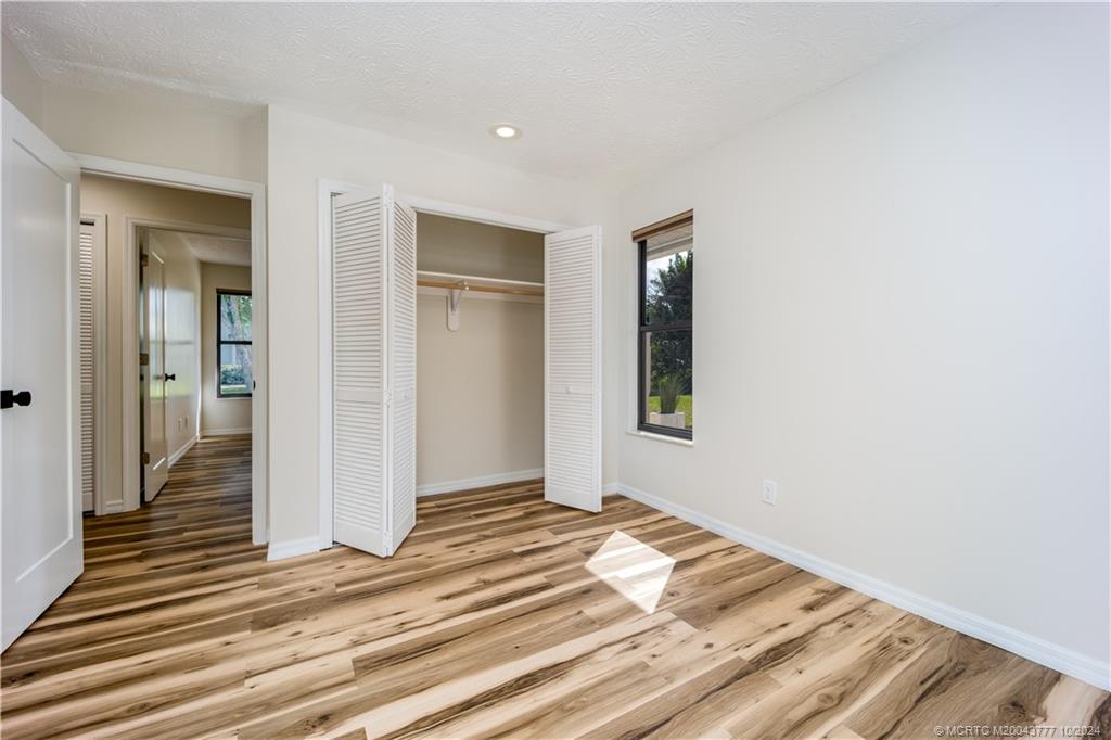 2556 Captiva Cove Stuart, FL 34994 - Photo 53 of 68 a view of a livingroom with wooden floor and white walls