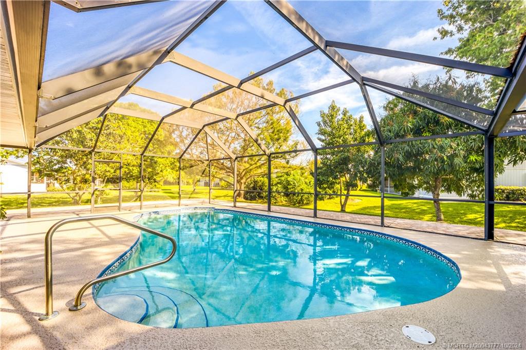 2556 Captiva Cove Stuart, FL 34994 - Photo 62 of 68 a view of a swimming pool with a patio