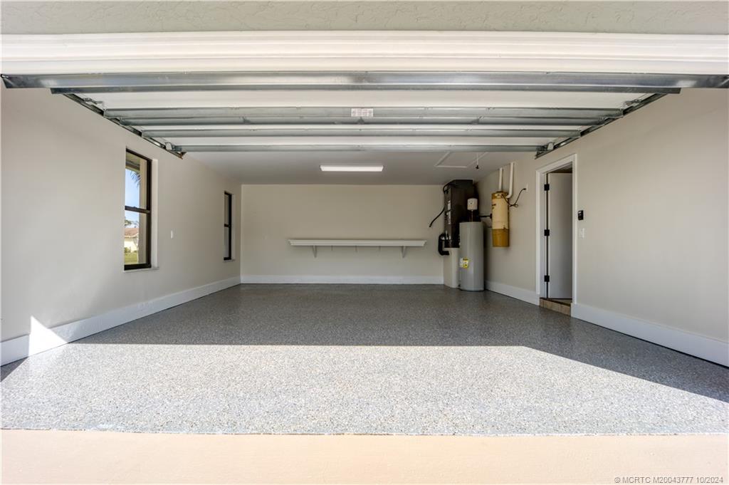 2556 Captiva Cove Stuart, FL 34994 - Photo 65 of 68 Deep 2 car garage with epoxy floor, new garage doo