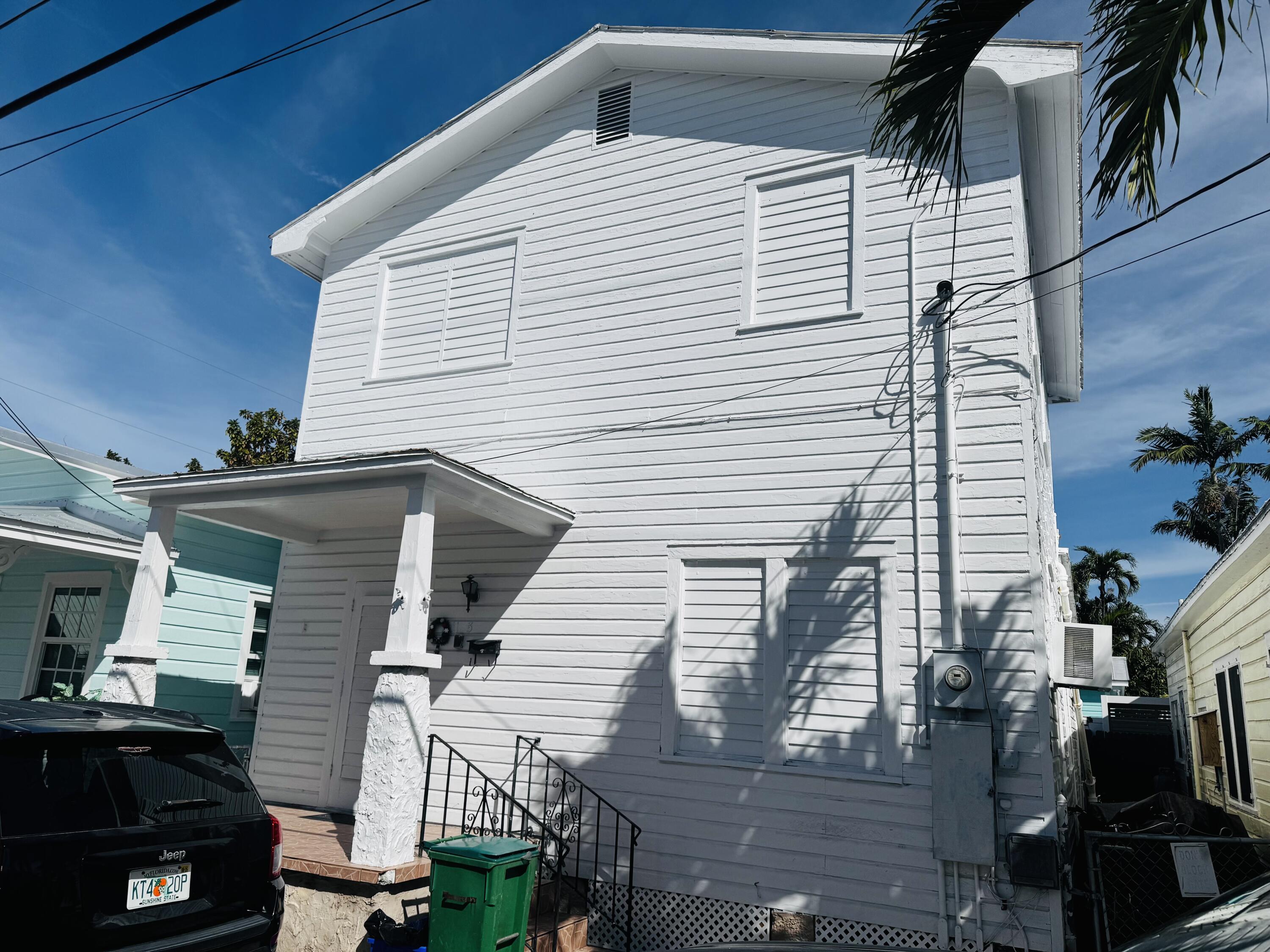 1105 Watson Street Key West, FL 33040 - Photo 1 of 26 a view of a house with a balcony