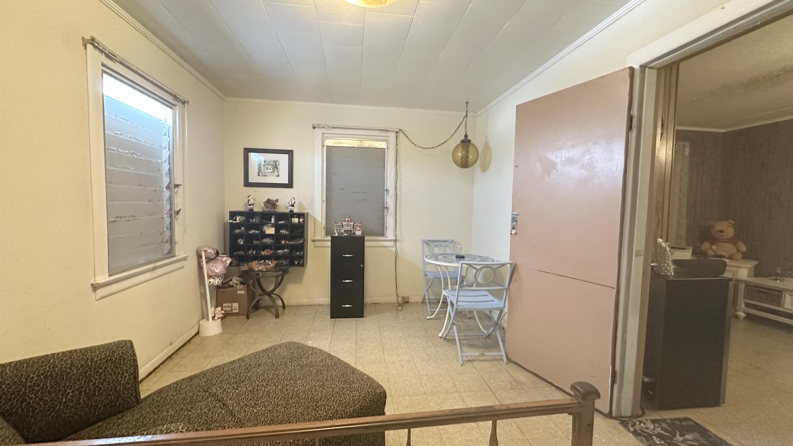 1105 Watson Street Key West, FL 33040 - Photo 12 of 26 a living room with furniture a rug and white walls